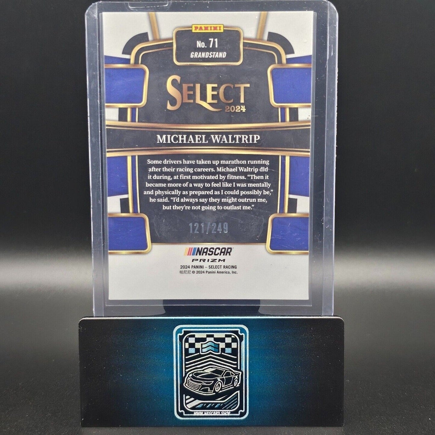 2024 Panini Select - Grandstand Red and Blue Prizm #71 Michael Waltrip /249