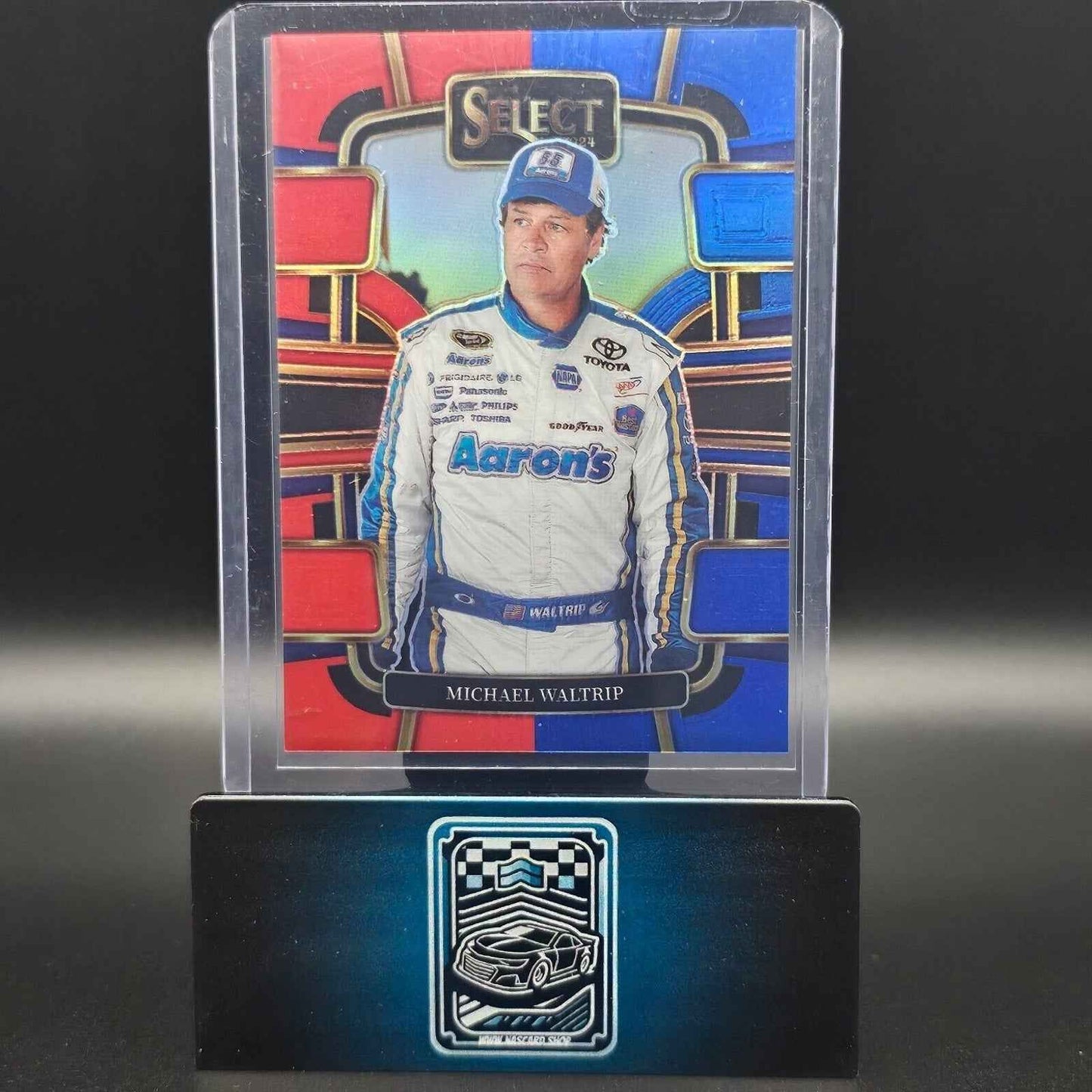 2024 Panini Select - Grandstand Red and Blue Prizm #71 Michael Waltrip /249